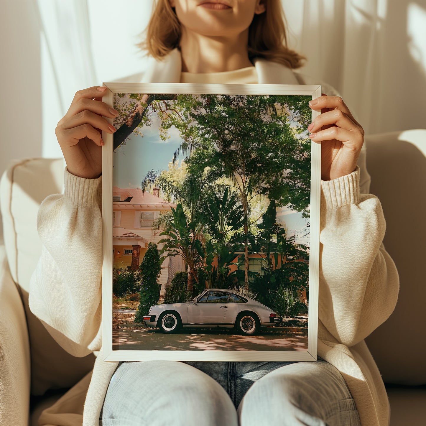 Woman holding vintage Havana Porsche poster front-facing