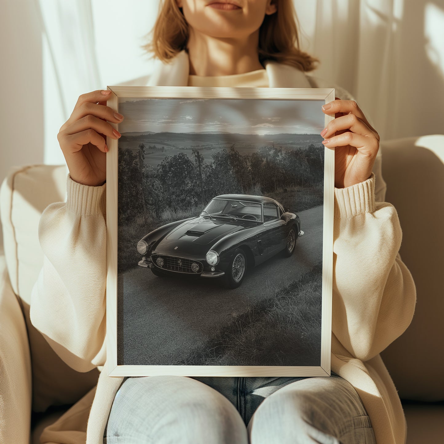 Woman holding Maranello Ferrari poster for size and proportion
